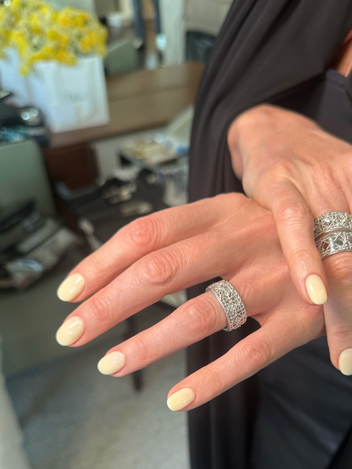 Charlize Theron with a butter yellow manicure
