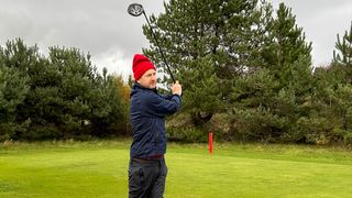 Male golfers playing off the red tees