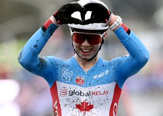 Ava Holmgren of Canada celebrates at finish line as junior women's silver medalist at 2023 Cyclocross World Championships in Hoogerheide