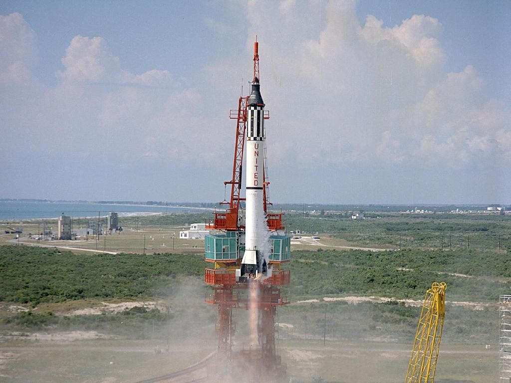 The Redstone booster carrying Mercury astronaut Alan B. Shepard, Jr. lifts off from Cape Canaveral at 9:34 a.m. Eastern on May 5, 1961. His 15 minute sub-orbital flight lifted him to an altitude of over 116 miles and a maximum speed of 5,134 miles per hour. Shepard had become the first American in space.