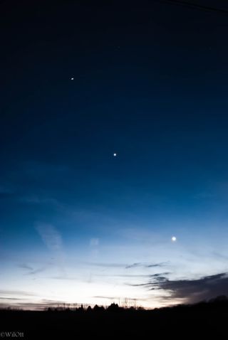 Skywatcher and nature photographer William Ott snapped this view of the planets Jupiter (top) and Venus shining with a crescent moon on Feb. 24, 2012 in the woodlands surrounding Woodstown, N.J.