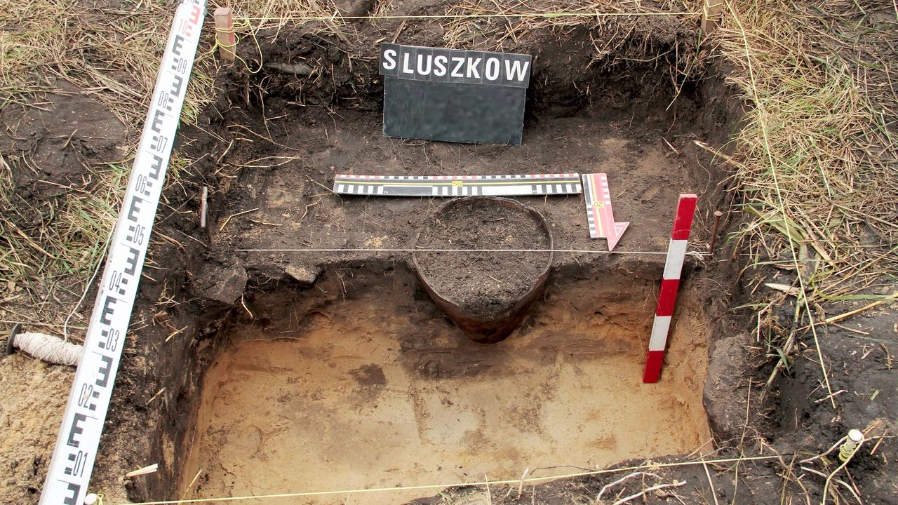 The excavation of the vessel containing the medieval hoard.