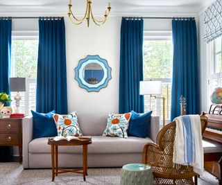 music room with blue curtains and cream sofa