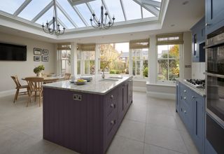 a kitchen conservatory extension with a roof lantern and french doors