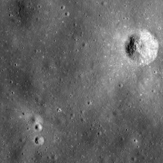 This photo by NASA's Lunar Reconnaissance Orbiter shows the Apollo 14 landing site and nearby Cone Crater. The trail followed by the Apollo 14 astronauts can be seen. Image width is 1 mile (1.6 kilometers).