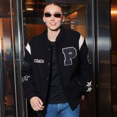 Paige Bueckers wearing a custom Coach varsity jacket with jeans during WNBA All-Star weekend in Chicago.