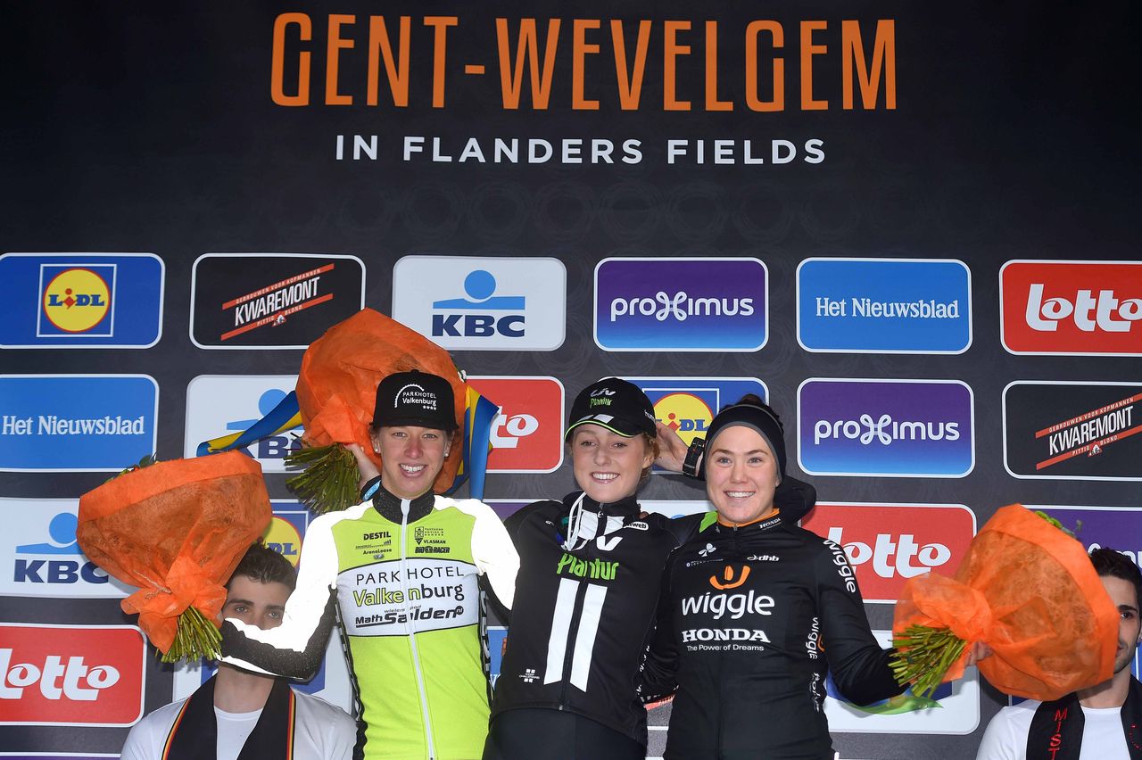 Floortje Mackaij, Janneke Ensing, and Chloe Hosking stand on the podium