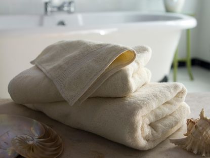 A stack of fluffy towels in a bathroom