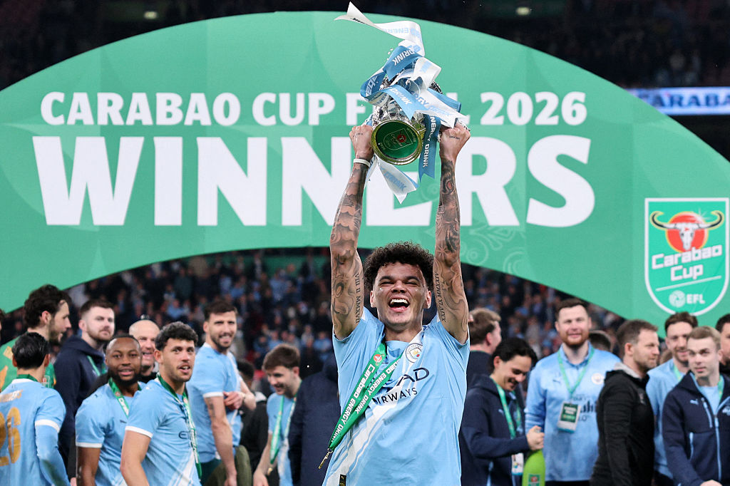 Manchester City's Nico O'Reilly lifts the Carabao Cup after defeating Arsenal in the 2026 final