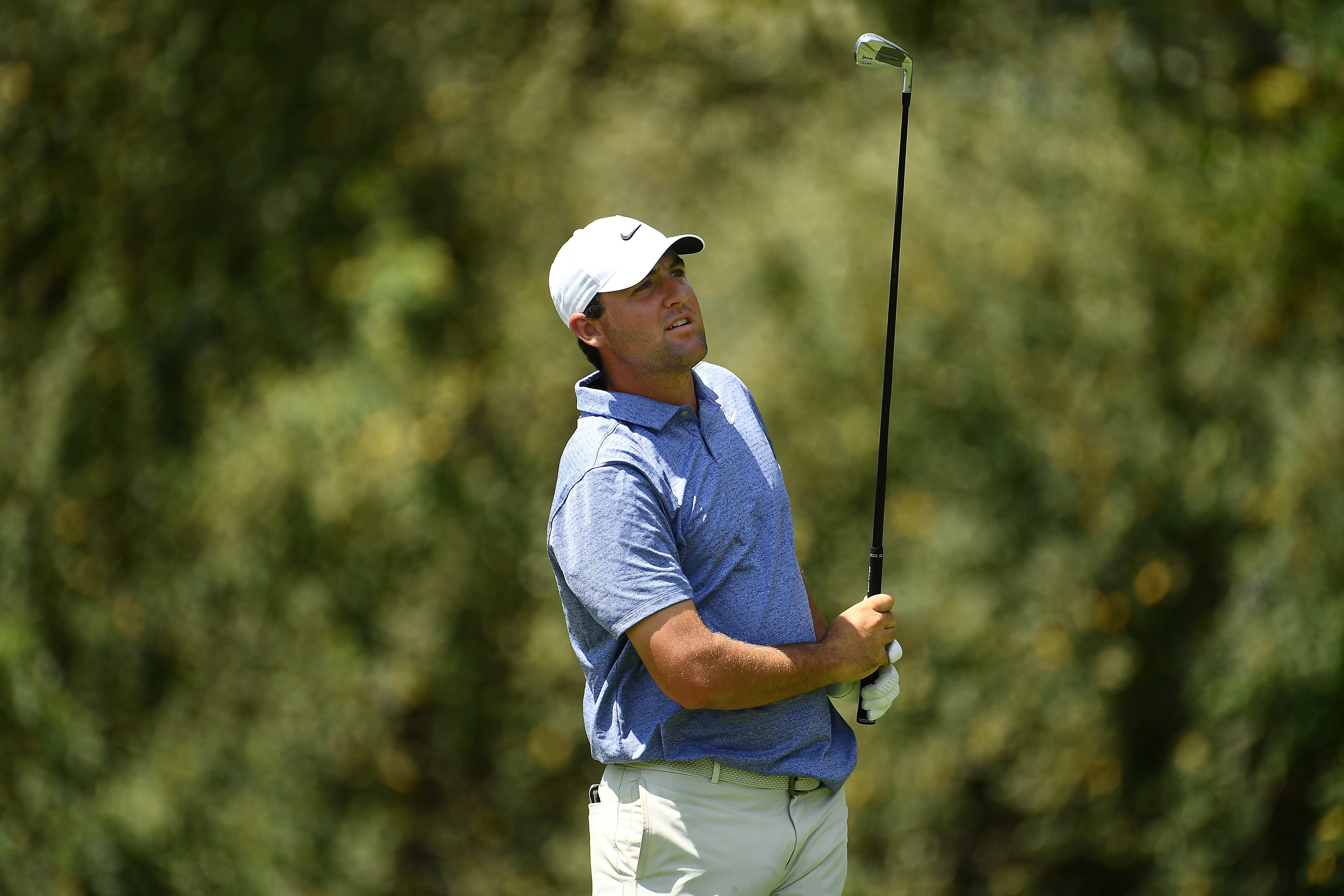 Scottie Scheffler hits a utility iron