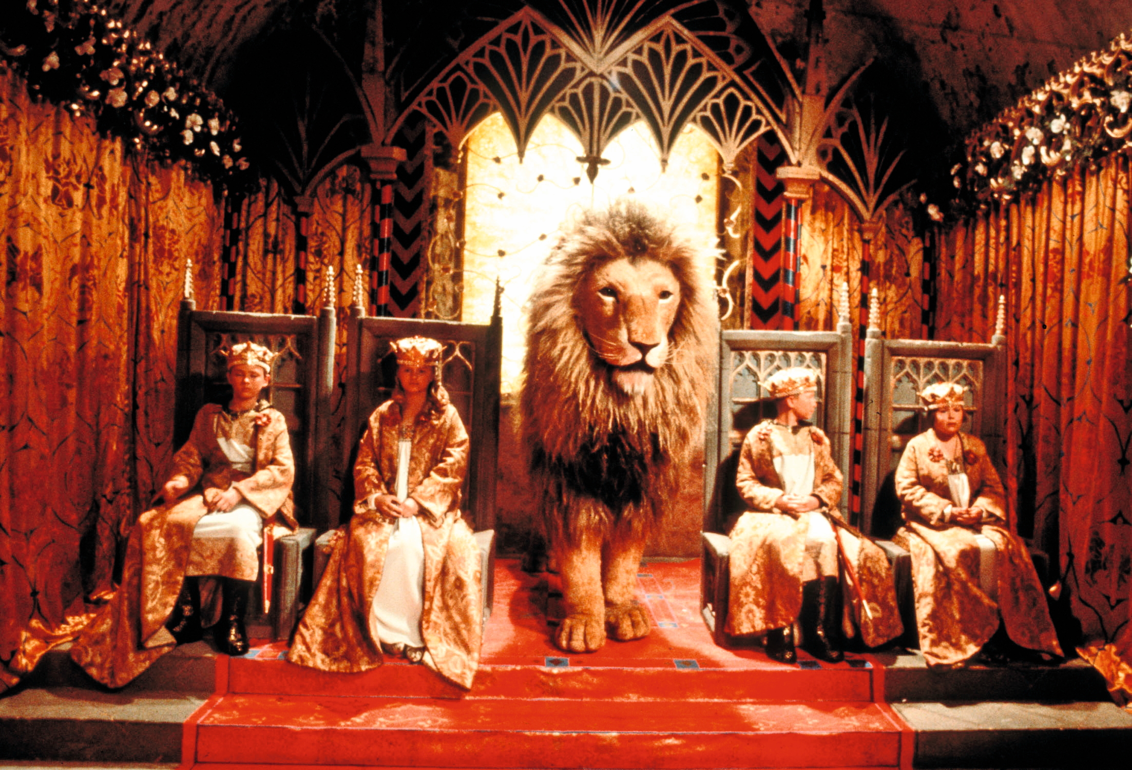 The four children and Aslan the lion in between them