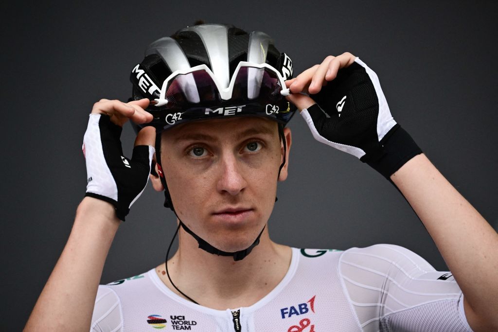 UAE Team Emirates Slovenian rider Tadej Pogacar adjusts his glasses as he awaits the start of the 1st stage of the 110th edition of the Tour de France cycling race 182 km departing and finishing in Bilbao in northern Spain on July 1 2023 Photo by Marco BERTORELLO AFP Photo by MARCO BERTORELLOAFP via Getty Images