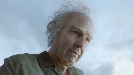 Tom Cruise in a green suit and made up in old makeup and prosthetics in Digger (2026).
