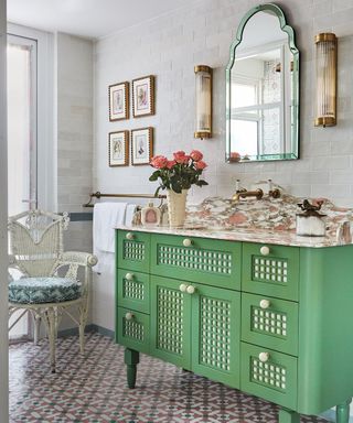 bathroom with patterned tiled flooring and gree washstand with marble top