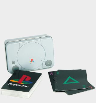 PlayStation playing cards with tin on a plain background