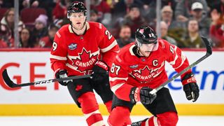 Sidney Crosby #87 of Team Canada skates ahead of teammate Nathan MacKinnon #29 in February 2025