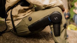 Hiker sitting down while testing the Arc&#039;teryx exoskeleton hiking pants