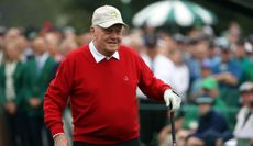 Jack Nicklaus waves to the crowd on the first tee of the Masters