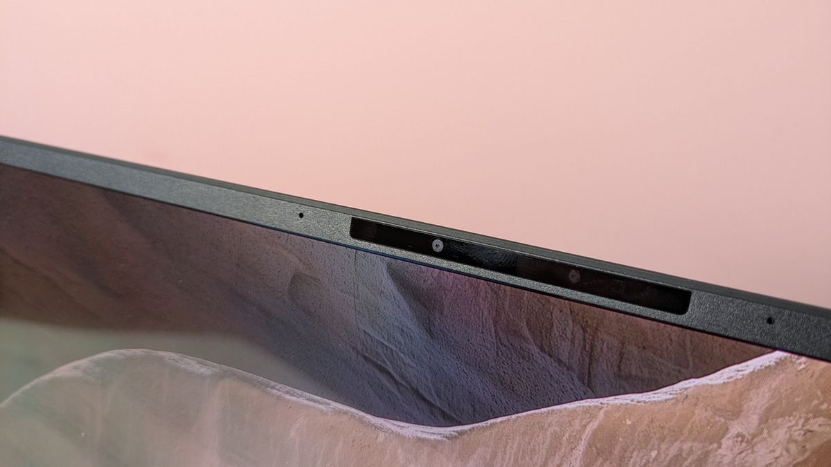 Close-up of webcam on Asus Zenbook A14, with pink wall in background