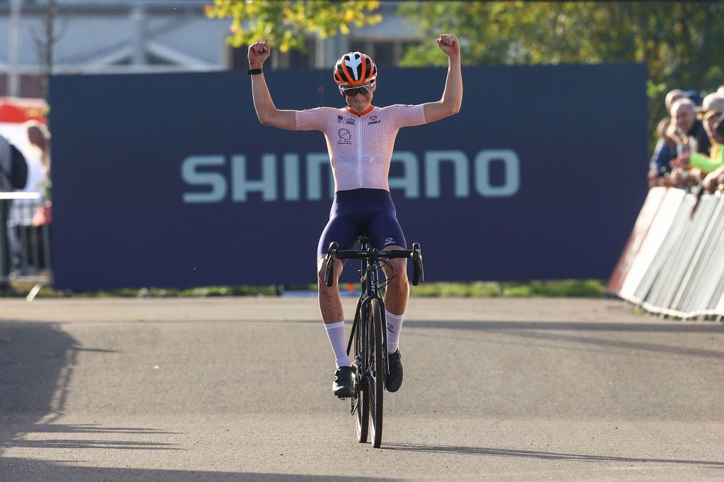 Dutch Guus Van de Eijnden celebrates as he crosses the finish line to win the men&#039;s junior race at the World Cup cyclocross in Maasmechelen