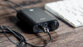 FiiO K3 USB amp on desk with wires attached