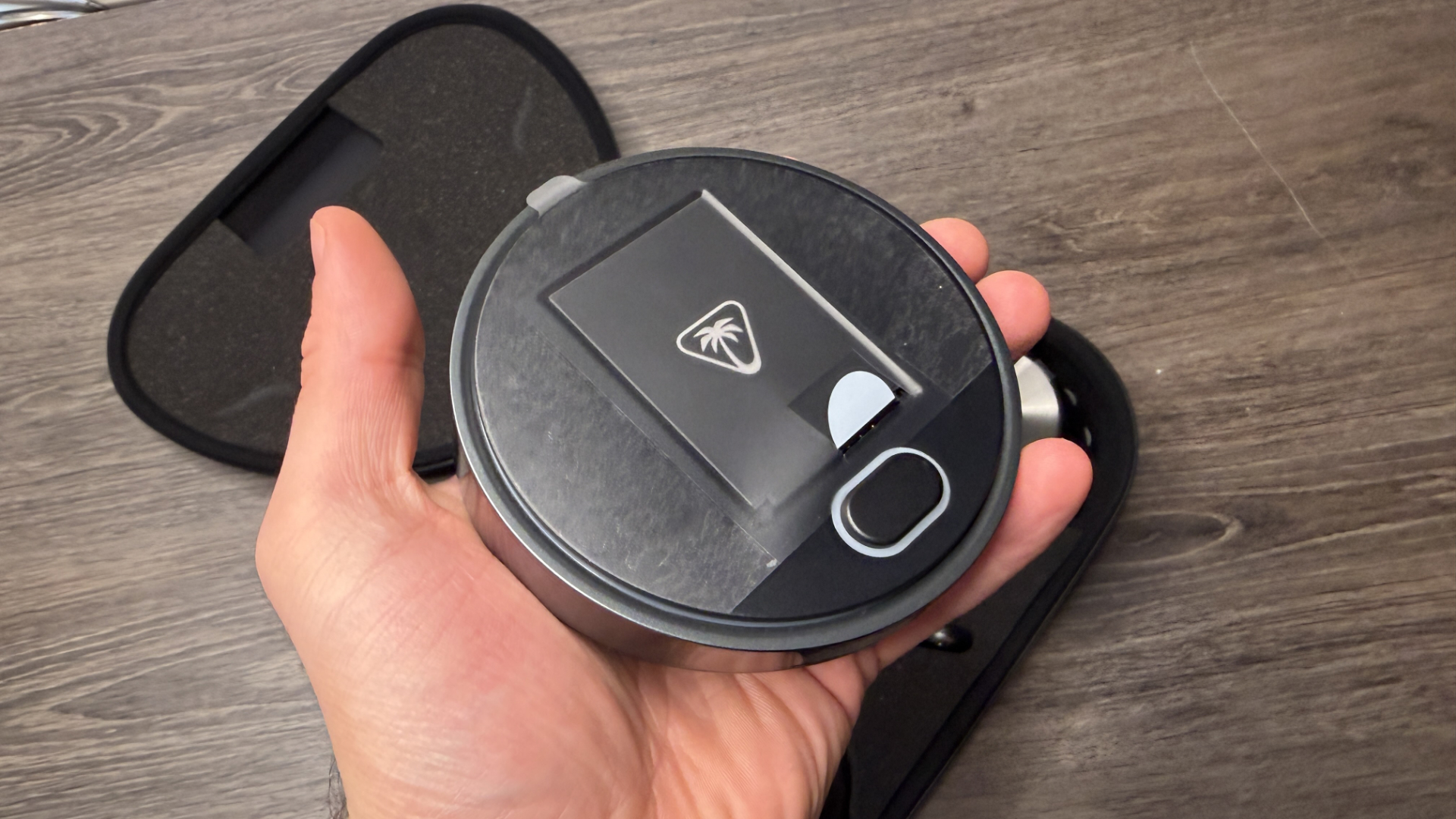 A man holding the Turtle Beach Stealth Pro 2s dock