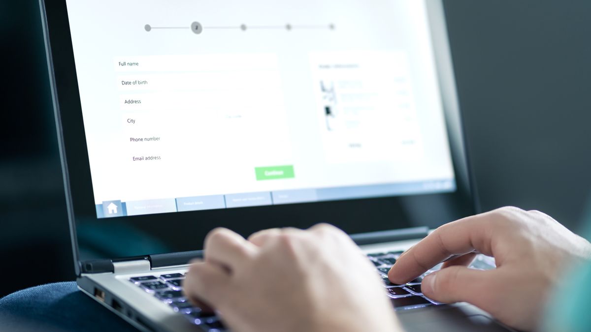 Person typing into a multi-page web form on a laptop - how to optimise web forms