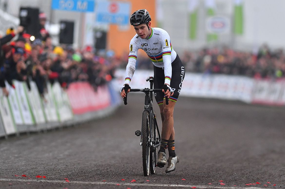 Woet Van Aert climbs off his bike for his celebration