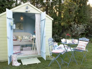 blue and light green she shed idea with country garden accessories