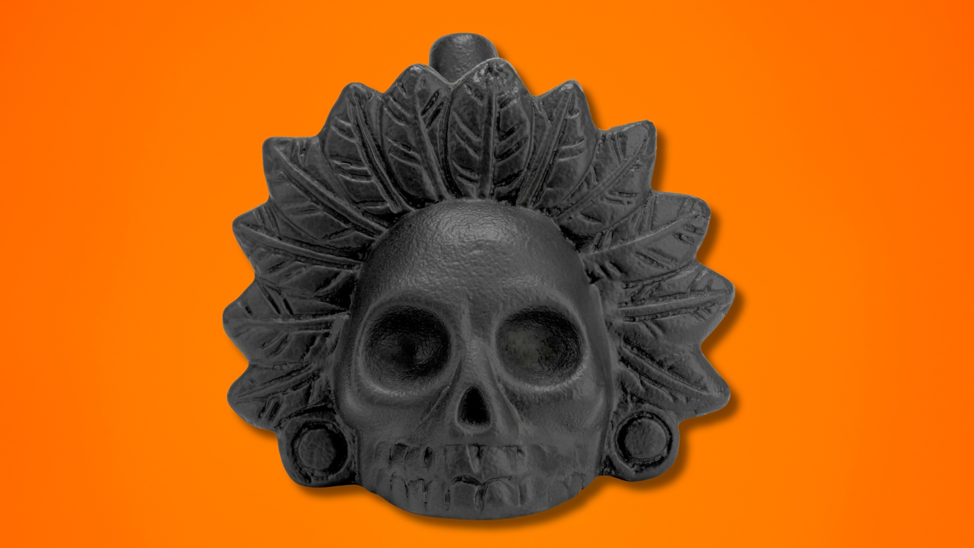 An Arkaeology ⁤Aztec Death Whistle on an orange background