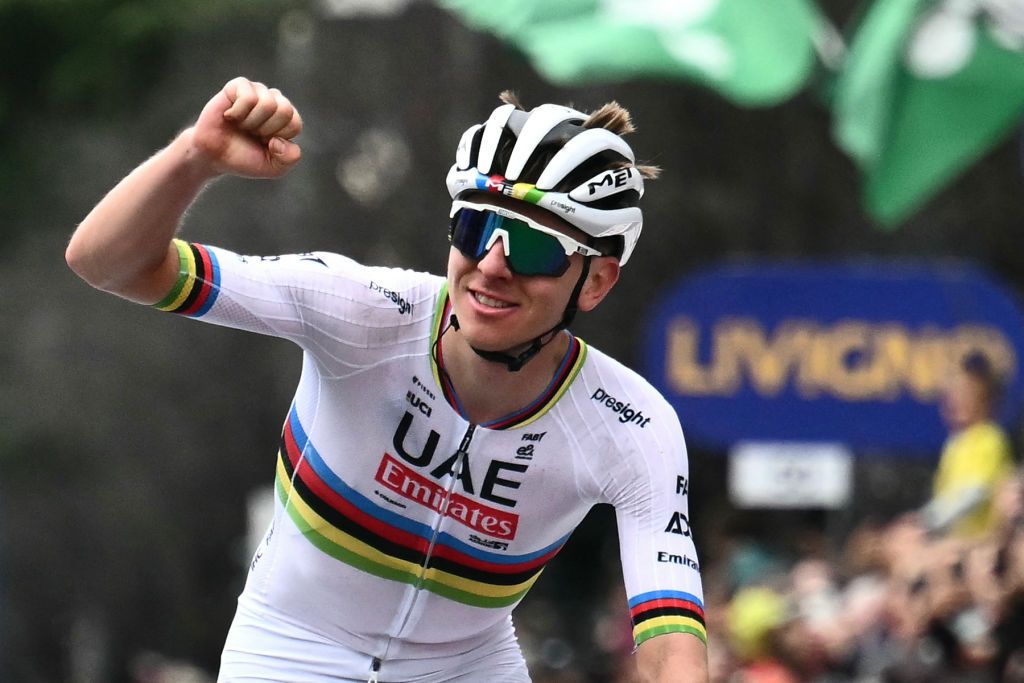 UAE Team Emirates team's Slovenian rider Tadej Pogacar celebrates his victory as he cycles to win the 118th edition of the Giro di Lombardia (Tour of Lombardy), a 252km cycling race from Bergamo to Como on October 12, 2024. (Photo by Marco BERTORELLO / AFP)