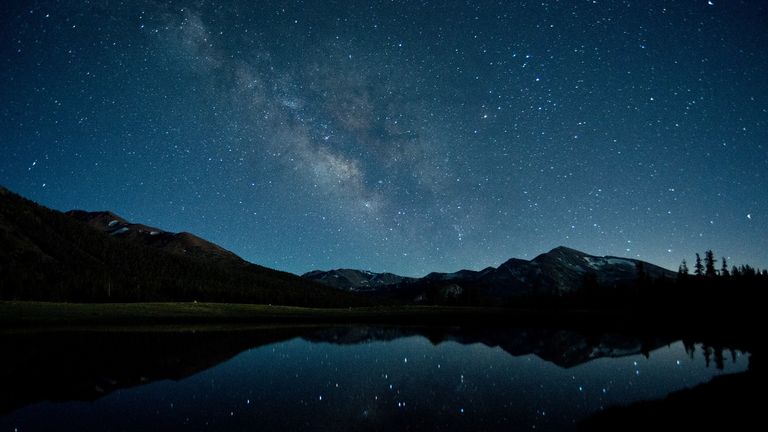 Milky Way reflecting in seasonal pond at 9,000 feet in Tuolumne Meadows, Yosemite