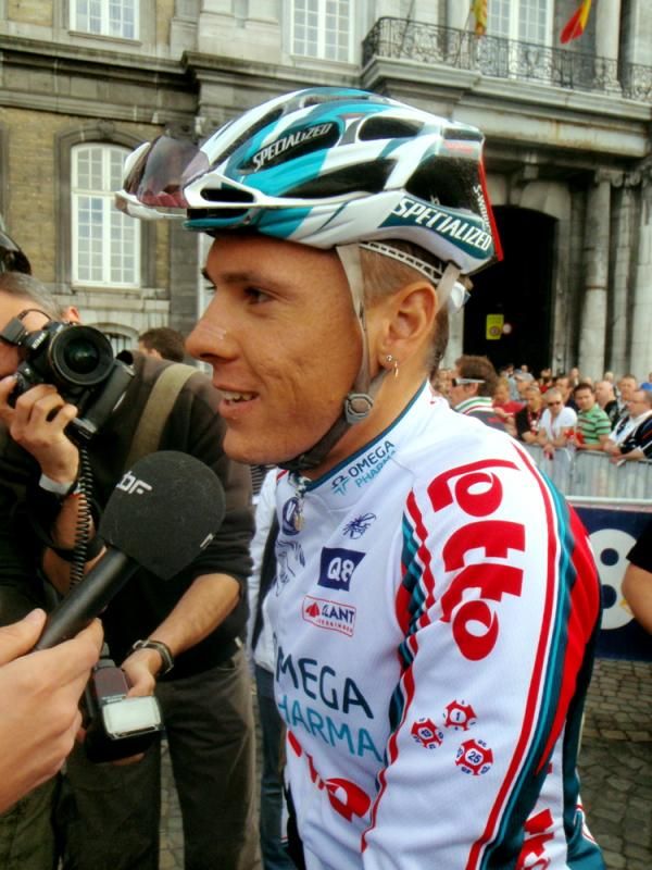 Philippe Gilbert (Omega Pharma-Lotto) was swarmed by the press after signing on