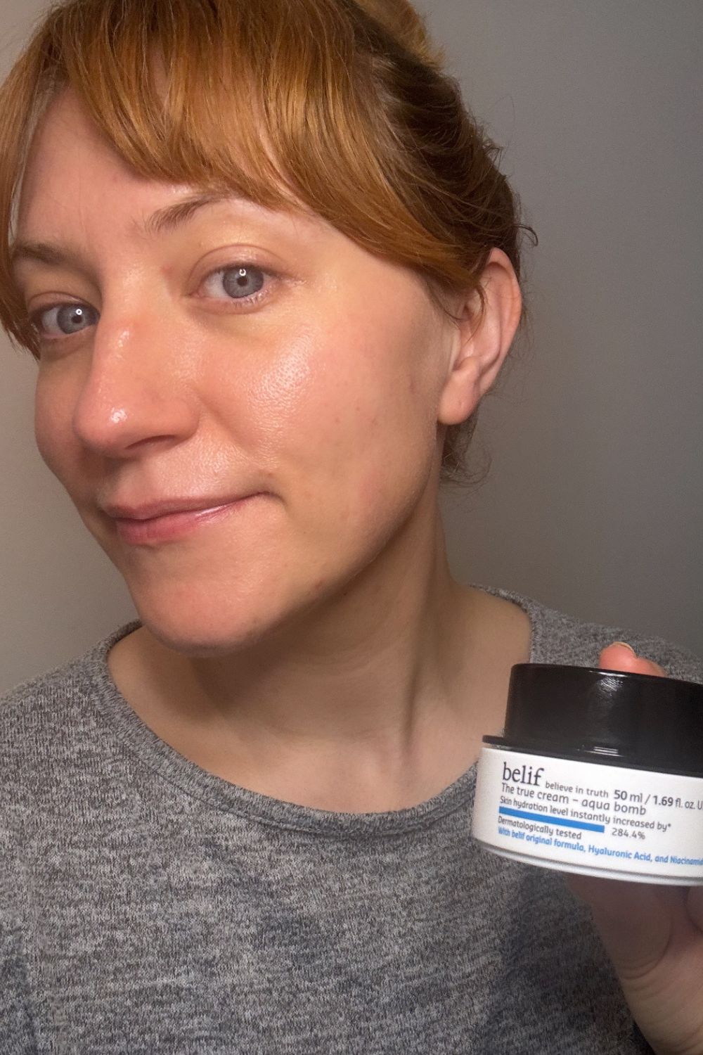 a headshot of matilda with a tub of belif aqua bomb