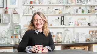 Sarah Hyndman sitting at a desk