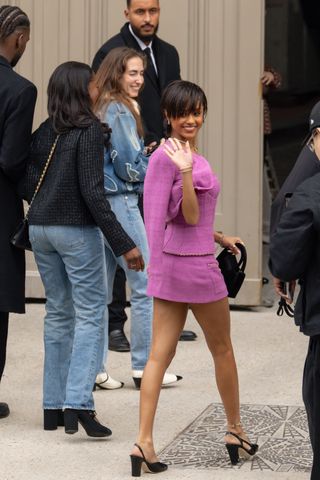 Tyla wears a matching skirt suit at the Chanel paris fashion week show on March 11