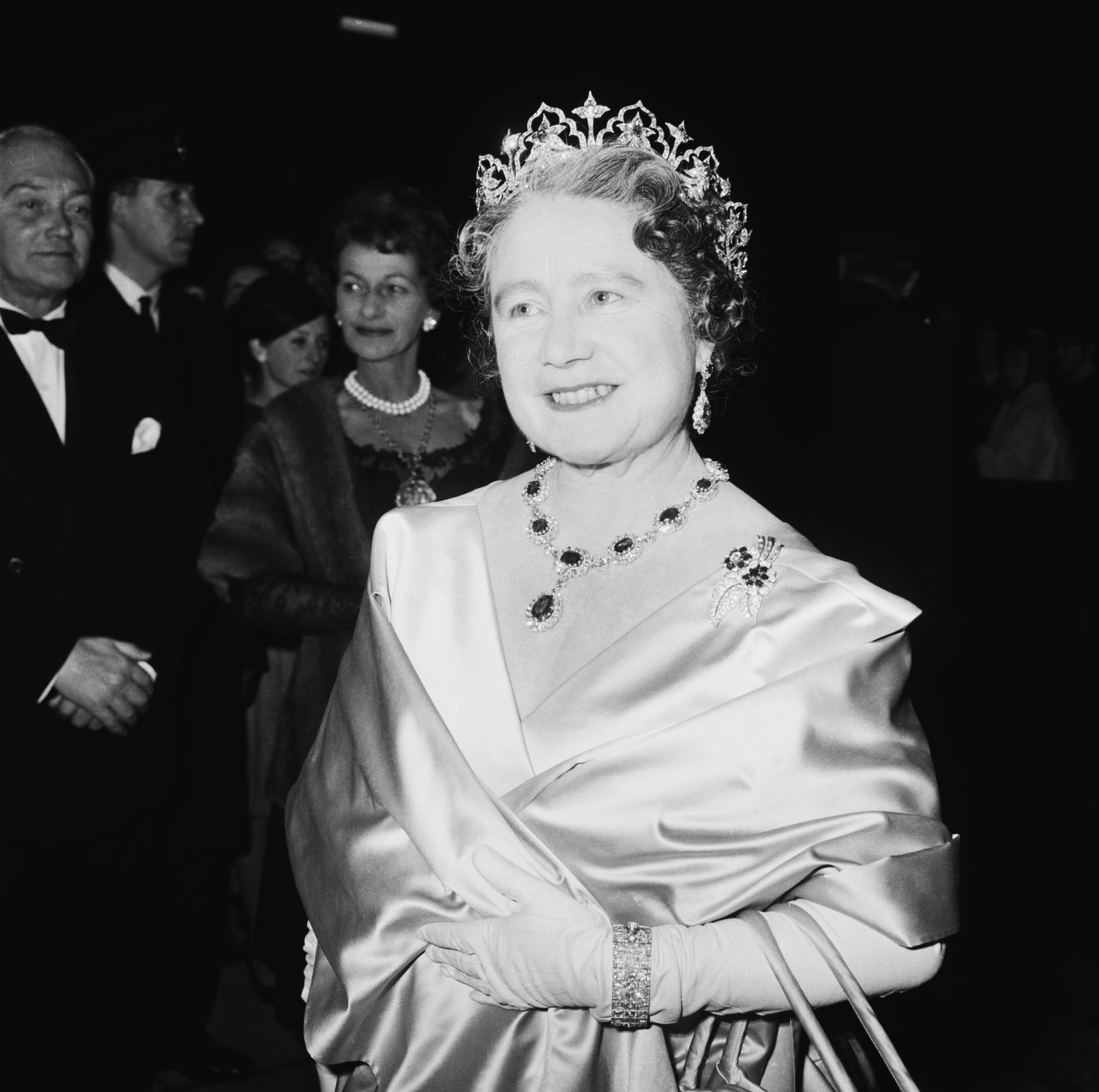 The Queen Mother (1900 - 2002) attends a performance at RADA (the Royal Academy of Dramatic Art), to celebrate the drama school&amp;amp;apos;s Diamond Jubilee (60th anniversary), London, UK, November 1964. (Photo by Terry Disney/Express/Getty Images)