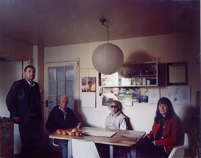 Four people around a wooden table