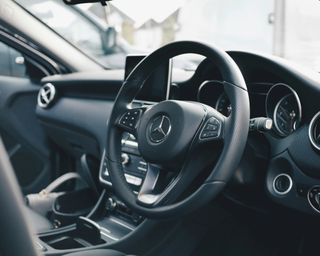 the steering wheel and interior of a car