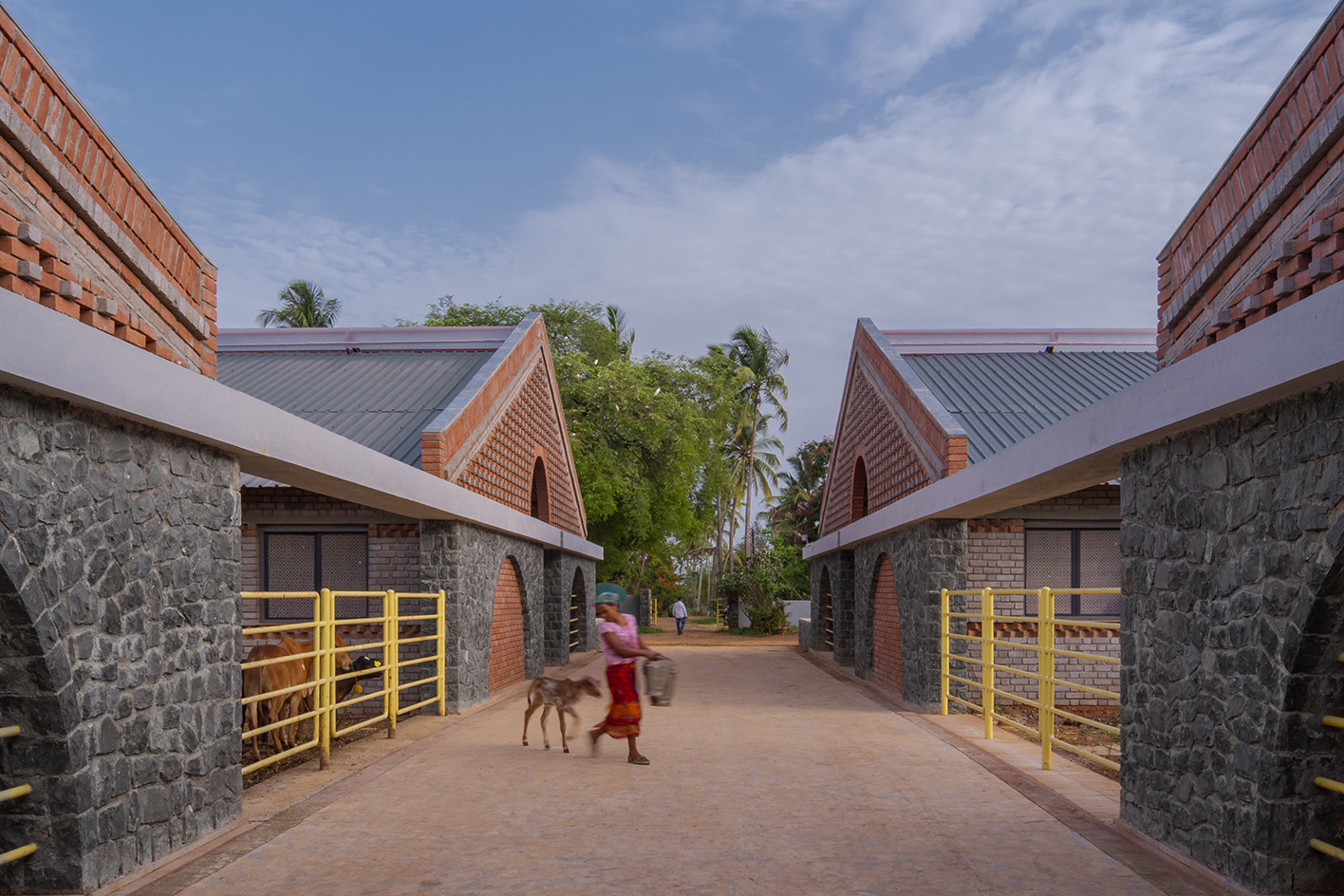 Gaugram , a cow shelter with pitched roofs and brick structure