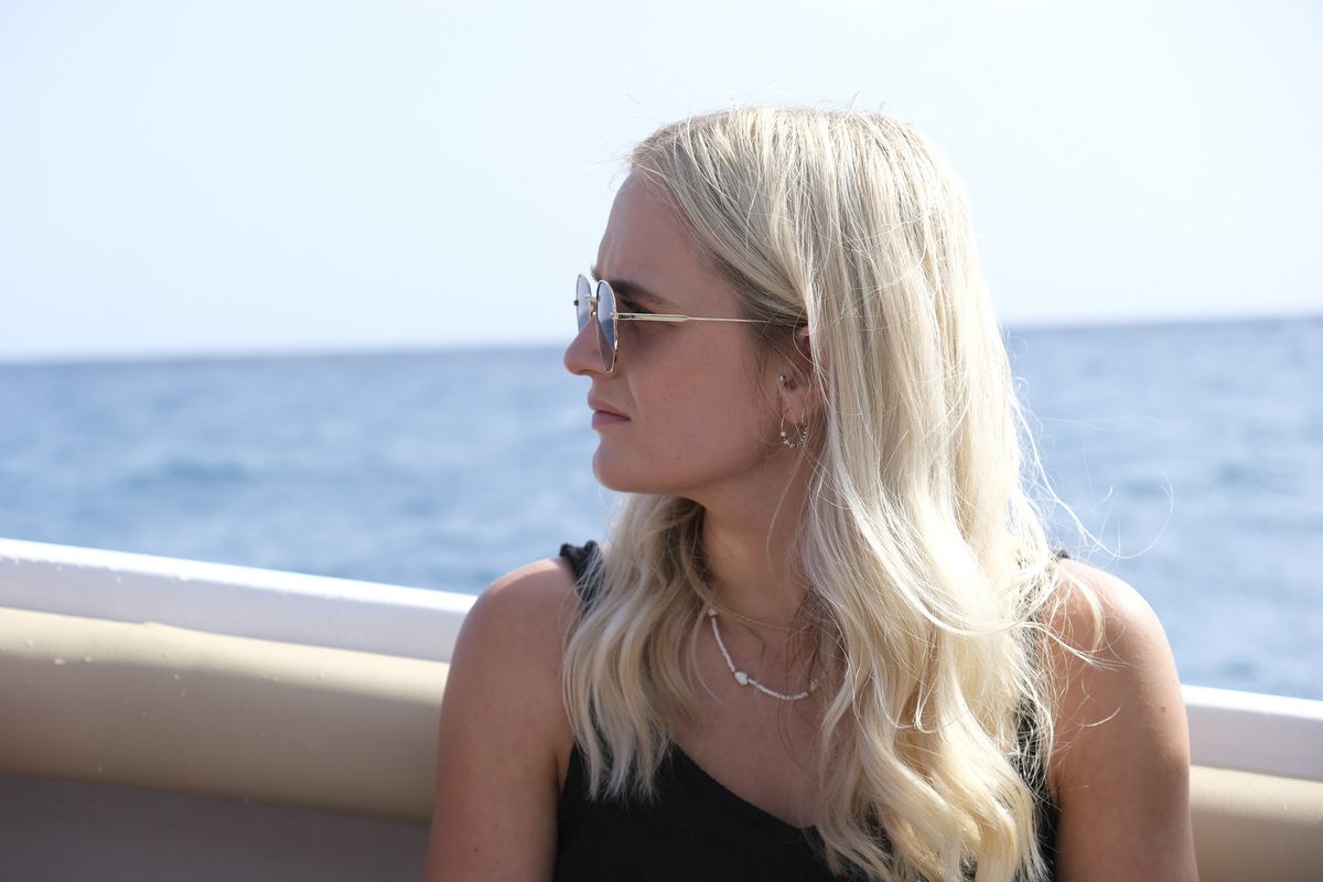 Portrait in the sun with ocean backdrop