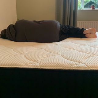 DreamCloud mattress with woman