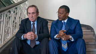 Tommy Lee Jones and Jamie Foxx sitting next to each other in The Burial