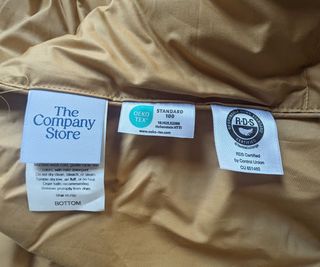 The care tags on the LaCrosse Premium Down Light Warmth Comforter.