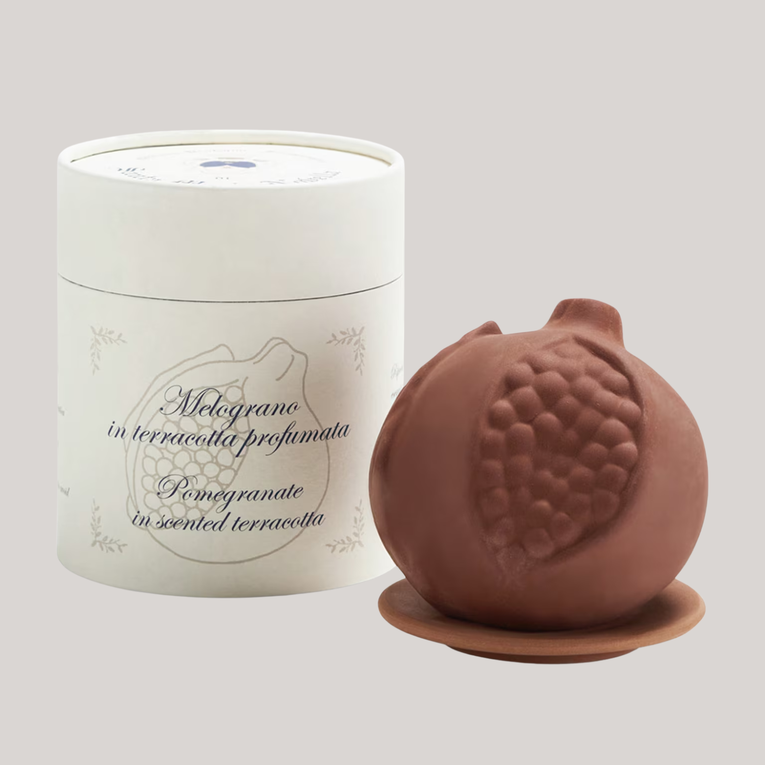 A terracotta pomegranate-shaped diffuser