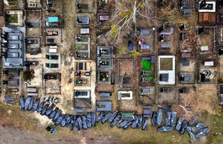 Body bags outside a Ukrainian cemetary