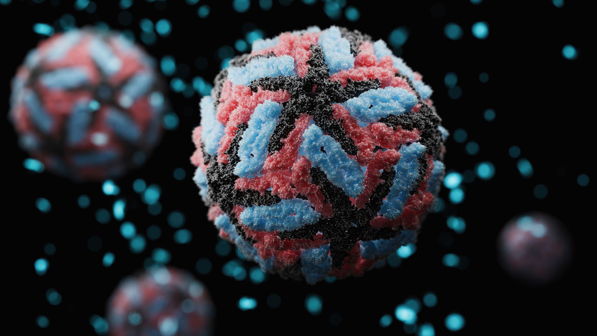 Spheres of red and blue and black against a dark background