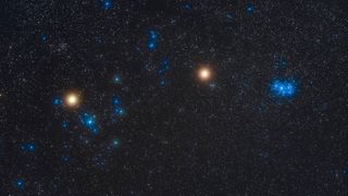 Orange Mars, at centre, between the blue Pleiades (at right) and the large Hyades (at left) star clusters with orange Aldebaran