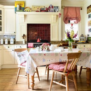 kitchen dinner with kitchen units tablecloth and blind