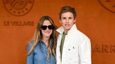 Hannah Bagshawe and Eddie Redmayne attend the 2025 French Open at Roland Garros